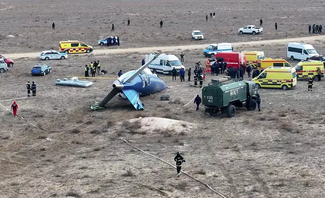 The wreckage of Azerbaijan Airlines Embraer 190 lays on the ground near the airport of Aktau, Kazakhstan, Wednesday, Dec. 25, 2024. (AP Photo/Azamat Sarsenbayev)