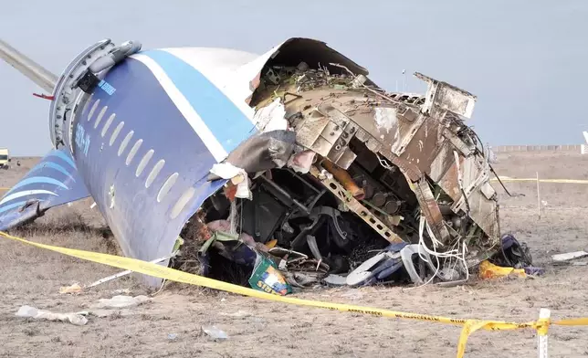 In this photo taken from a video released by the administration of Mangystau region, the wreckage of Azerbaijan Airlines Embraer 190 lies on the ground near the airport of Aktau, Kazakhstan, Wednesday, Dec. 25, 2024. (The Administration of Mangystau Region via AP)