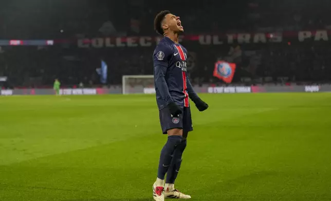 PSG's Desire Doue reacts during the French League One soccer match between Paris Saint-Germain and Lyon at the Parc des Princes in Paris, Sunday, Dec. 15, 2024. (AP Photo/Aurelien Morissard)