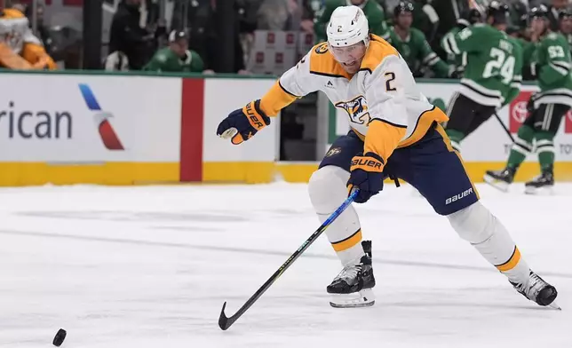 Nashville Predators defenseman Luke Schenn (2) skates after the puck in the first period of an NHL hockey game against the Dallas Stars Thursday, Dec. 12, 2024, in Dallas. (AP Photo/LM Otero)