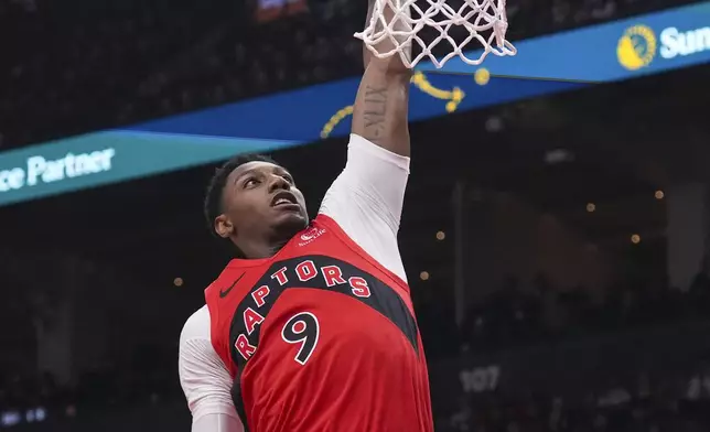 Toronto Raptors' RJ Barrett scores during first-half NBA basketball game action against the Miami Heat in Toronto, Sunday, Dec. 1, 2024. (Chris Young/The Canadian Press via AP)