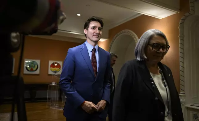 Canada's Prime Minister Justin Trudeau and Gov. Gen. Mary Simon depart after Dominic LeBlanc, not shown, was sworn in as Finance Minister during a ceremony at Rideau Hall in Ottawa, Ontario, Monday, Dec. 16, 2024. (Justin Tang/The Canadian Press via AP)