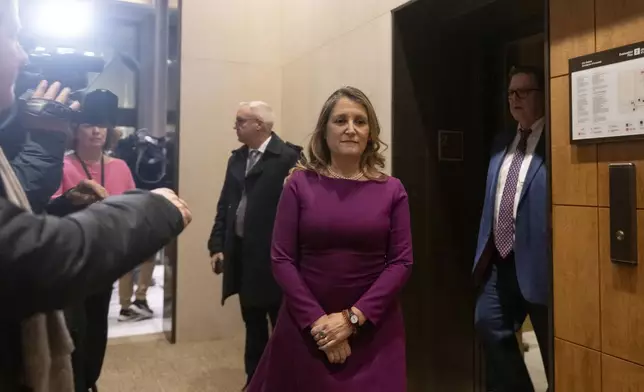 Chrystia Freeland, who today stepped down as finance minister and deputy prime minister, arrives for a national caucus meeting, in Ottawa, Ontario, Monday, Dec. 16, 2024. (Spencer Colby/The Canadian Press via AP)