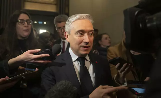 Canada's Minister of Innovation, Science and Industry Francois-Philippe Champagne arrives for a national caucus meeting, in Ottawa, Ontario, Monday, Dec. 16, 2024. (Spencer Colby/The Canadian Press via AP)