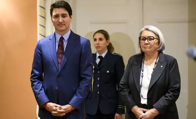 Canada's Prime Minister Justin Trudeau and Gov. Gen. Mary Simon look on at the start of a cabinet swearing in ceremony for Dominic LeBlanc, not shown, who will be sworn in as Finance Minister, at Rideau Hall in Ottawa, Ontario, Monday, Dec. 16, 2024. (Justin Tang/The Canadian Press via AP)