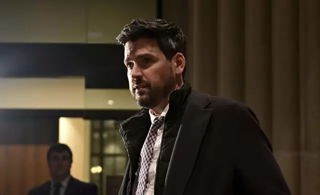 Sean Fraser, who today stepped down as minister of housing, arrives for a national caucus meeting, in Ottawa, Ontario, Monday, Dec. 16, 2024. (Spencer Colby/The Canadian Press via AP)