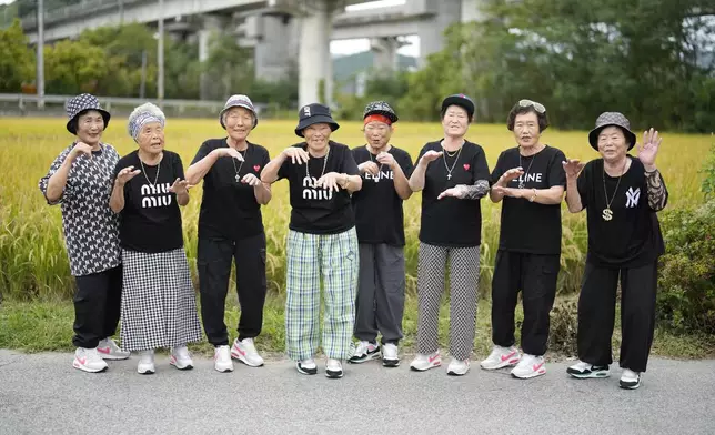 FILE - Members of Suni and the Seven Princesses pose for a photo in Chilgok, South Korea, Oct. 3, 2024. (AP Photo/Lee Jin-man, File)