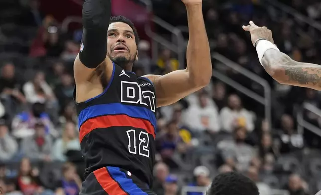 Detroit Pistons forward Tobias Harris (12) attempts a basket during the first half of an NBA basketball game against the Philadelphia 76ers, Saturday, Nov. 30, 2024, in Detroit. (AP Photo/Carlos Osorio)