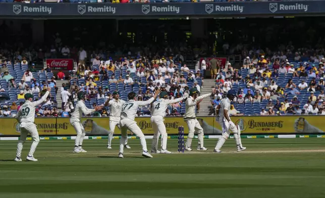 Australian players reacts as India's Akash Deep bats during play on the last day of the fourth cricket test between Australia and India at the Melbourne Cricket Ground, Melbourne, Australia, Monday, Dec. 30, 2024. (AP Photo/Asanka Brendon Ratnayake)