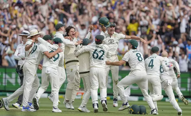 Australian players celebrates after winning the fourth test cricket match against India at the Melbourne Cricket Ground, Melbourne, Australia, Monday, Dec. 30, 2024. (AP Photo/Asanka Brendon Ratnayake)