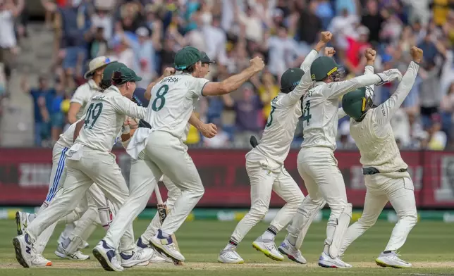 Australian players celebrates after winning the fourth test cricket match against India at the Melbourne Cricket Ground, Melbourne, Australia, Monday, Dec. 30, 2024. (AP Photo/Asanka Brendon Ratnayake)