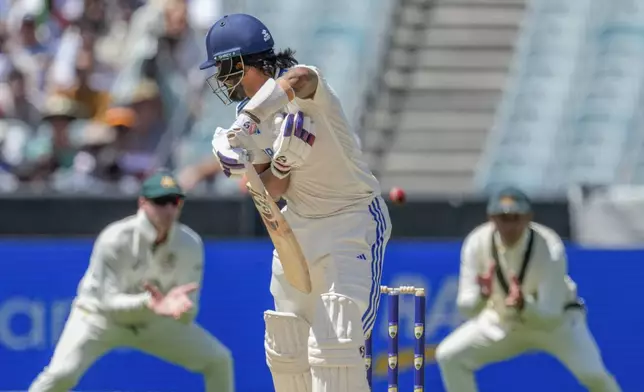 India's KL Rahul edges the ball which is then caught by Australia's Usman Khawaja during play on the last day of the fourth cricket test between Australia and India at the Melbourne Cricket Ground, Melbourne, Australia, Monday, Dec. 30, 2024. (AP Photo/Asanka Brendon Ratnayake)