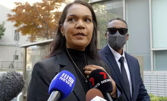 Kristal Hilaire, a daughter of Australian citizen Donna Nelson, speaks to reporters at the Chiba District Court before the verdict for Nelson in a drug smuggling case, Wednesday, Dec. 4, 2024, in Chiba, east of Tokyo. (AP Photo/Mari Yamaguchi)