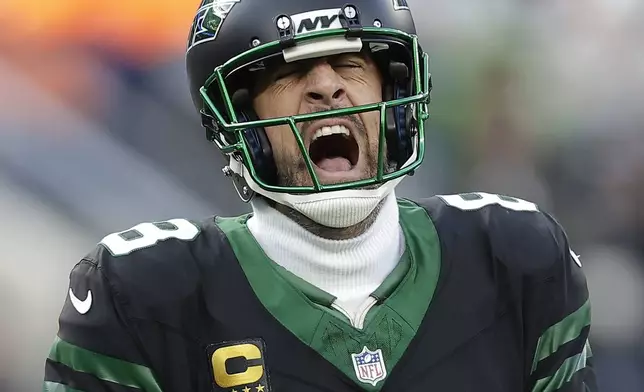 New York Jets quarterback Aaron Rodgers (8) reacts after overthrowing a pass against the Seattle Seahawks during the second quarter of an NFL football game, Sunday, Dec. 1, 2024, in East Rutherford, N.J. (AP Photo/Adam Hunger)