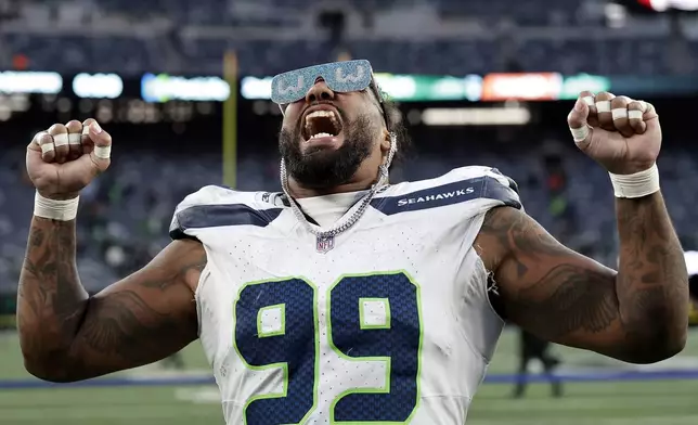 Seattle Seahawks defensive end Leonard Williams (99) reacts walking off the field after an NFL football game against the New York Jets Sunday, Dec. 1, 2024, in East Rutherford, N.J. (AP Photo/Adam Hunger)