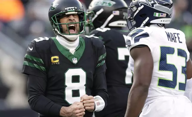 New York Jets quarterback Aaron Rodgers (8) reacts after overthrowing a pass against the Seattle Seahawks during the second quarter of an NFL football game, Sunday, Dec. 1, 2024, in East Rutherford, N.J. (AP Photo/Adam Hunger)