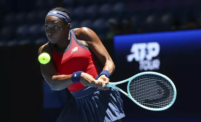 Coco Gauff of the United States hits a return shot to Donna Vekic of Croatia during their United Cup tennis match in Perth, Australia, Tuesday, Dec. 31, 2024. (AP Photo/Trevor Collens)
