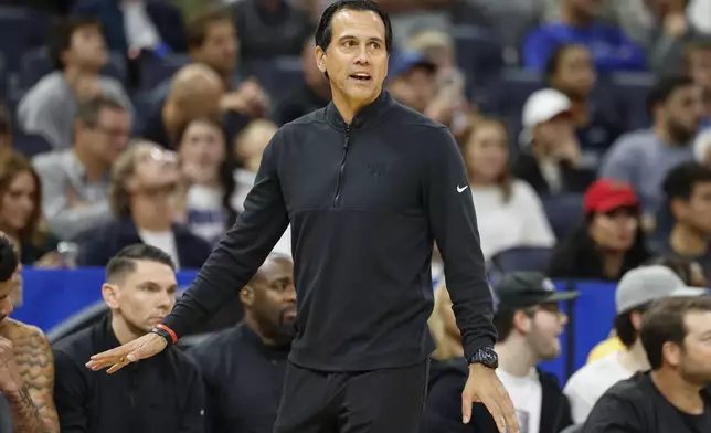 Miami Heat head coach Erik Spoelstra reacts to his team playing the Orlando Magic during the first half of an NBA basketball game, Thursday, Dec. 26, 2024, in Orlando, Fla. (AP Photo/Kevin Kolczynski)