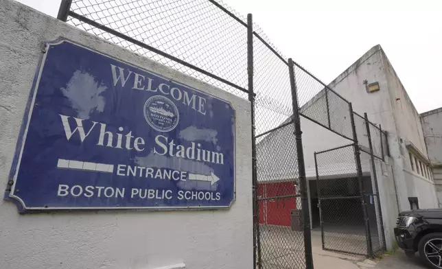 A sign marking an entrance to White Stadium hangs near an open gate at the stadium, Wednesday, Sept. 18, 2024, in Boston. (AP Photo/Steven Senne)