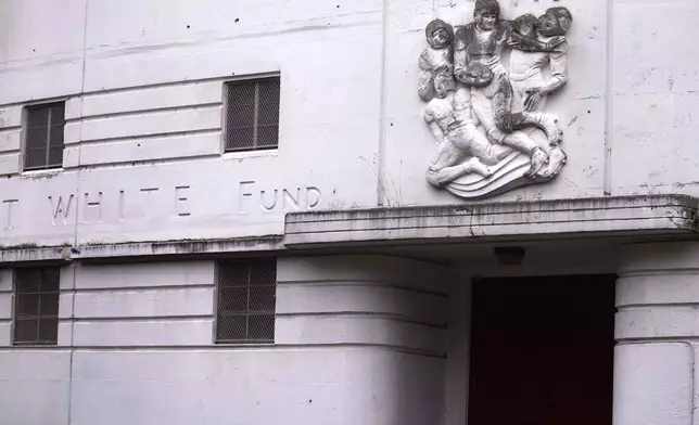 A football player sculpture is shown on the vintage facade of White Stadium, Thursday, Sept. 26, 2024, at Franklin Park in Boston. A plan to renovate the aging stadium in Boston for a professional women's soccer team has sparked controversy over concerns it will displace some youth sports and limit access to a public park in one of the city's most diverse neighborhoods. (AP Photo/Charles Krupa)p