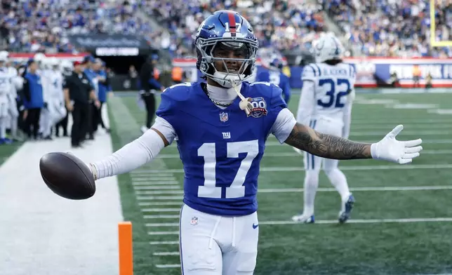 New York Giants wide receiver Wan'Dale Robinson (17) celebrates after scoring a touchdown against the Indianapolis Colts in the first half of an NFL football game Sunday, Dec. 29, 2024, in East Rutherford, N.J. (AP Photo/Corey Sipkin)