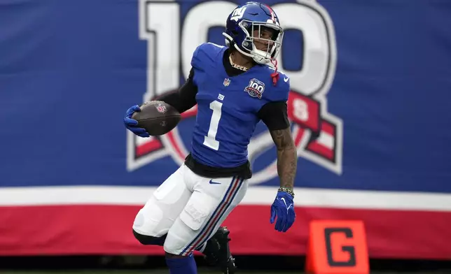 New York Giants wide receiver Malik Nabers (1) scores his second touchdown of the game against the Indianapolis Colts in the second half of an NFL football game Sunday, Dec. 29, 2024, in East Rutherford, N.J. (AP Photo/Seth Wenig)