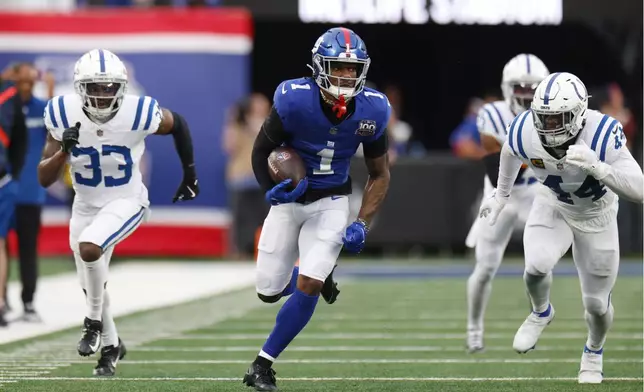 New York Giants wide receiver Malik Nabers (1) scores his second touchdown of the game against the Indianapolis Colts in the second half of an NFL football game Sunday, Dec. 29, 2024, in East Rutherford, N.J. (AP Photo/Corey Sipkin)