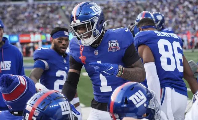 New York Giants wide receiver Malik Nabers (1) celebrates after catching a touchdown pass against the Indianapolis Colts in the first half of an NFL football game Sunday, Dec. 29, 2024, in East Rutherford, N.J. (AP Photo/Seth Wenig)