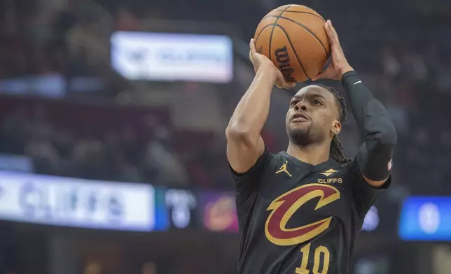 Cleveland Cavaliers' Darius Garland (10) shoots against the Philadelphia 76ers during the first half of an NBA basketball game in Cleveland, Saturday Dec. 21, 2024. (AP Photo/Phil Long)