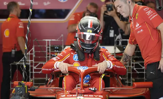 Ferrari driver Arthur Leclerc of Monaco prepares for his debut free practice ahead of the Formula One Abu Dhabi Grand Prix at the Yas Marina Circuit in Abu Dhabi, UAE, Friday, Dec. 6, 2024. (AP Photo/Darko Bandic)