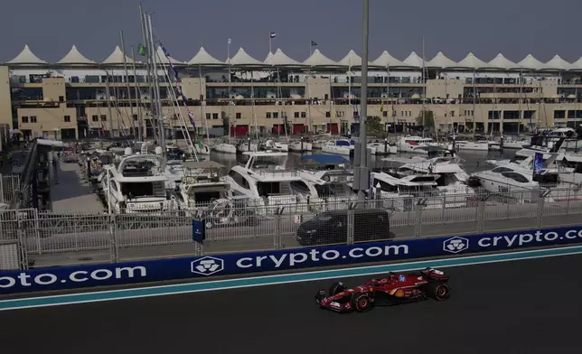 Ferrari driver Charles Leclerc of Monaco in action during the first free practice ahead of the Formula One Abu Dhabi Grand Prix at the Yas Marina Circuit in Abu Dhabi, UAE, Friday, Dec. 6, 2024. (AP Photo/Altaf Qadri)