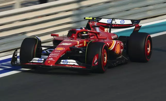 Ferrari driver Arthur Leclerc of Monaco in action during the first free practice ahead of the Formula One Abu Dhabi Grand Prix at the Yas Marina Circuit in Abu Dhabi, UAE, Friday, Dec. 6, 2024. (AP Photo/Altaf Qadri)