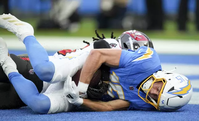 Los Angeles Chargers wide receiver Ladd McConkey (15) makes a touchdown catch during the first half of an NFL football game against the Tampa Bay Buccaneers Sunday, Dec. 15, 2024, in Inglewood, Calif. (AP Photo/Eric Thayer)