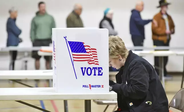 FILE - Melissa Warner, of Johnstown, Pa., marks her ballot on Election Day at Westmont Borough No. 1 polling place at Westmont Grove in Cambria County, Tuesday, Nov. 5, 2024. (Thomas Slusser/The Tribune-Democrat via AP, File)