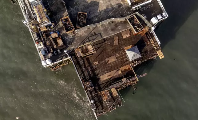 The damaged Santa Cruz Wharf is seen after a section of the pier fell into the ocean during high surf the previous day, in Santa Cruz, Calif., Tuesday, Dec. 24, 2024. (Stephen Lam/San Francisco Chronicle via AP)