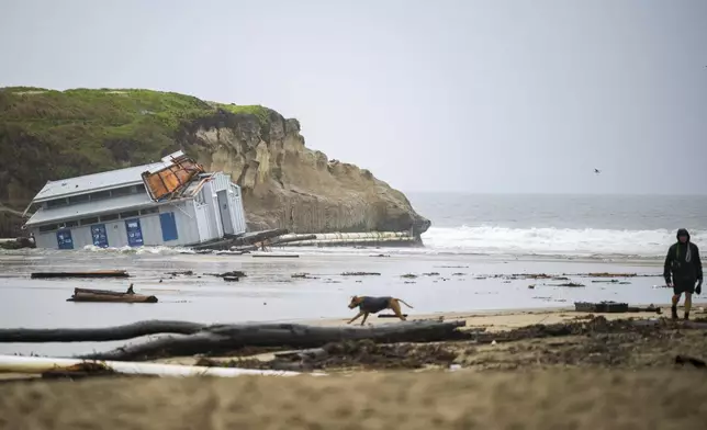 Remnants of a bathroom that fell off the wharf are seen at the mouth of the San Lorenzo River in Santa Cruz, Calif., Tuesday, Dec. 24, 2024. (AP Photo/Nic Coury)