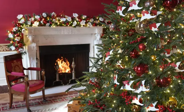 The Red Room of the White House in Washington, is decorated for the holidays, Monday, Dec. 2, 2024. (AP Photo/Susan Walsh)