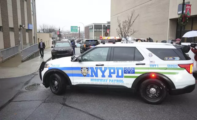 New York Police officers arrive at Altoona Police Department, where a man with a gun thought to be similar to the one used in the killing of UnitedHealthcare CEO Brian Thompson has been taken into police custody for questioning, Monday, Dec. 9, 2024, in Altoona, Pa. (AP Photo/Gene J. Puskar)