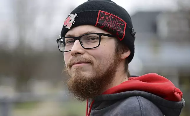 Nicholas Fontaine poses for a portrait outside his home in Akron, Ohio, Tuesday, Dec. 3, 2024. Fontaine is charged with one count of illegal voting. (AP Photo/David Dermer)