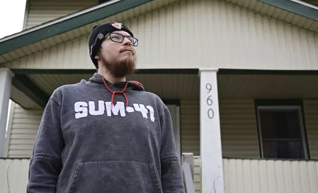 Nicholas Fontaine poses for a portrait outside his home in Akron, Ohio, Tuesday, Dec. 3, 2024. Fontaine is charged with one count of illegal voting. (AP Photo/David Dermer)