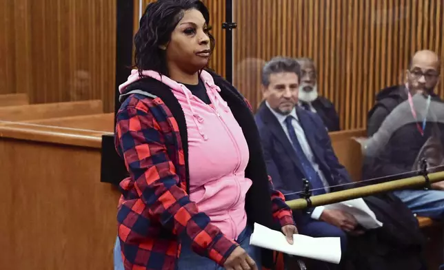 Fiona Allen walks toward the bench for her arraignment in Cuyahoga County Common Pleas Court, Tuesday, Dec. 3, 2024, in Cleveland. Allen is accused of illegally voting in five different elections since 2020. Though Allen is a legal resident of the United States, prosecutors say she is not an American citizen. (AP Photo/David Dermer)