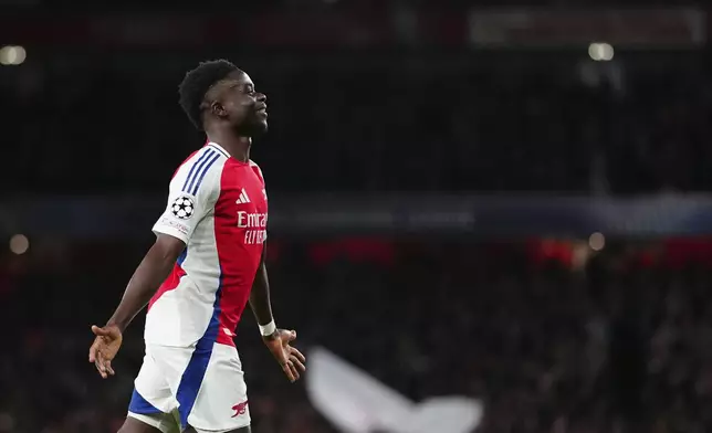 Arsenal's Bukayo Saka, celebrates after scoring his side's second goal during the Champions League opening phase soccer match between Arsenal and Monaco, at the Emirates Stadium in London, Wednesday , Dec.11, 2024. (AP Photo/Dave Shopland)