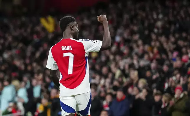 Arsenal's Bukayo Saka, celebrates after scoring his side's second goal during the Champions League opening phase soccer match between Arsenal and Monaco, at the Emirates Stadium in London, Wednesday , Dec.11, 2024. (AP Photo/Dave Shopland)