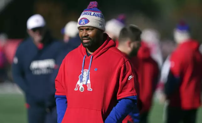 New England Patriots head coach Jerod Mayo stands on the field before an NFL football game against the Indianapolis Colts, Sunday, Dec. 1, 2024, in Foxborough, Mass. (AP Photo/Charles Krupa)