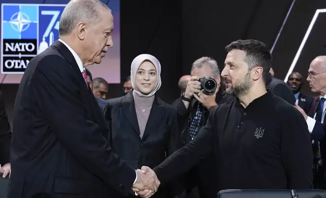 FILE - Turkish President Recep Tayyip Erdogan, left, greets Ukrainian President Volodymyr Zelenskyy during a working session of the NATO summit in Washington, on July 11, 2024. (AP Photo/Susan Walsh, File)