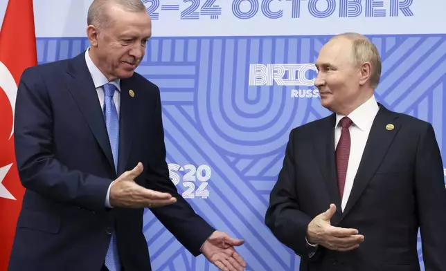 FILE - Russian President Vladimir Putin, right, meets with Turkish President Recep Tayyip Erdogan on the sidelines of the BRICS summit in Kazan, Russia, on Oct. 23, 2024. (Mikhail Metzel, Sputnik, Kremlin Pool Photo via AP, File)