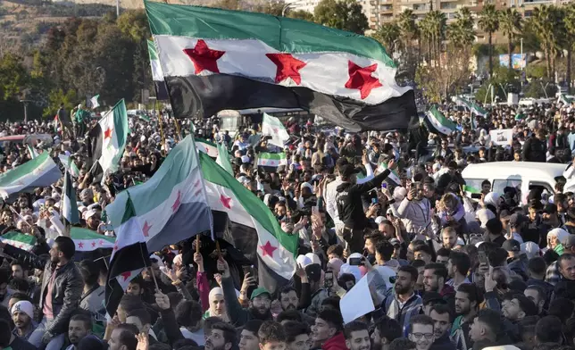 FILE - Syrians celebrate at the first Friday prayers since Bashar Assad's ouster at the central square in Damascus, Syria, on Dec. 13, 2024. (AP Photo/Hussein Malla, File)