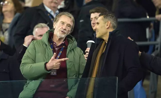 Manchester United owner Sir Jim Ratcliffe, left, talks with Manchester City chairman Khaldoon Al Mubarak ahead the English Premier League soccer match between Manchester City and Manchester United at the Etihad Stadium in Manchester, Sunday, Dec. 15, 2024. (AP Photo/Dave Thompson)