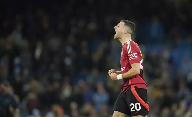 Manchester United's Diogo Dalot reacts during the English Premier League soccer match between Manchester City and Manchester United at the Etihad Stadium in Manchester, Sunday, Dec. 15, 2024. (AP Photo/Dave Thompson)