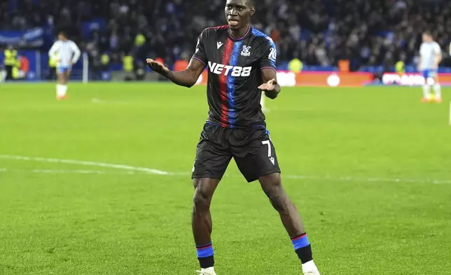 Crystal Palace's Ismaila Sarr celebrates scoring during the English Premier League soccer match between Brighton and Hove Albion and Crystal Palace, at the American Express Stadium, in Brighton and Hove, England, Sunday, Dec. 15, 2024. (Zac Goodwin/PA via AP)